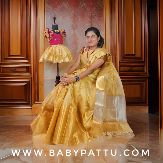 Gold tissue saree and baby dress combo